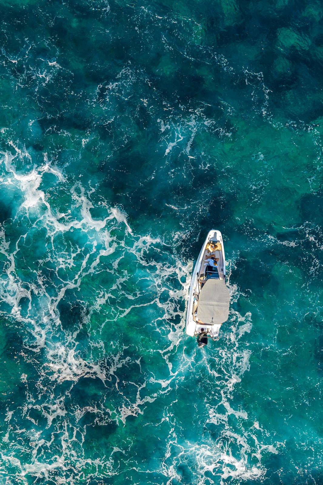 Axopar 22 seen from above in turquoise water